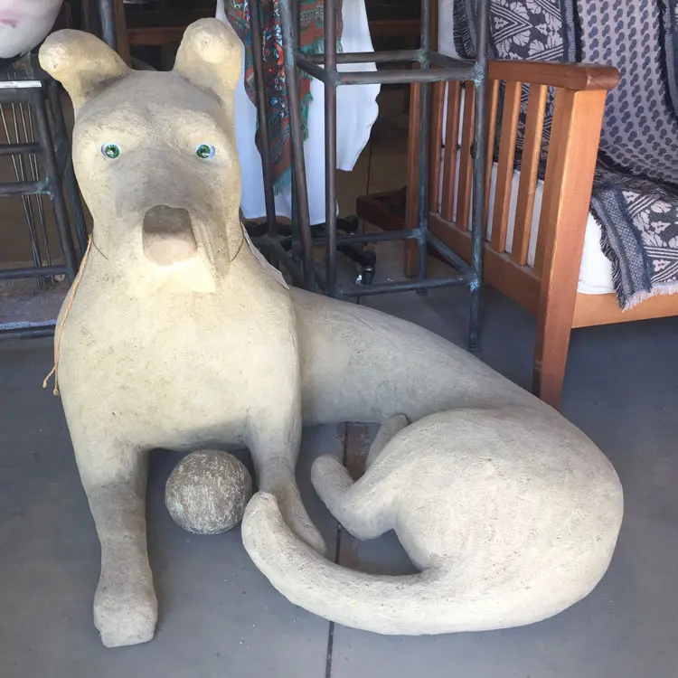 Statue of a dog with ball